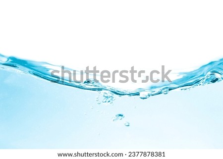 The water moves through the clear glass, showing the waves and blue bubbles.
