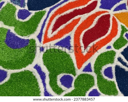 Traditional Indian art form that is created with colored sand or powder. This is festive and artistic way of celebrating Diwali, the festival of lights, and it is meant to bring good luck to the home. Royalty-Free Stock Photo #2377883457
