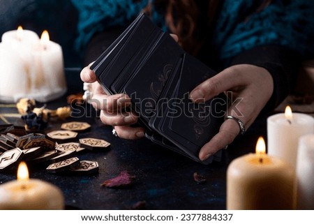 Fortune-telling on tarot cards, the hands of a fortune-teller Royalty-Free Stock Photo #2377884337