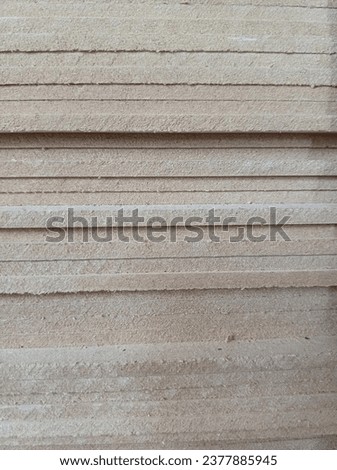 the texture of wood grain compressed into a board