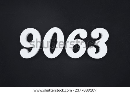 Black for the background. The number 9063 is made of white painted wood.
