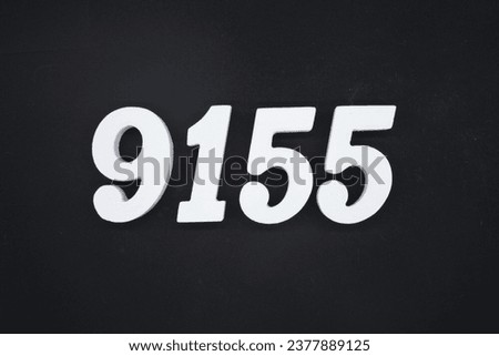 Black for the background. The number 9155 is made of white painted wood.