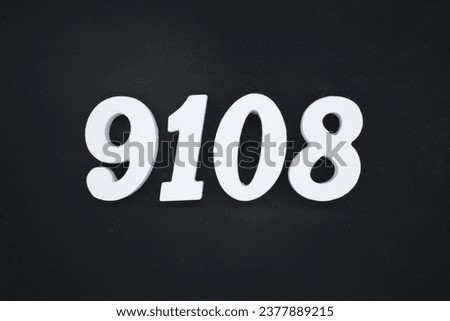 Black for the background. The number 9108 is made of white painted wood.