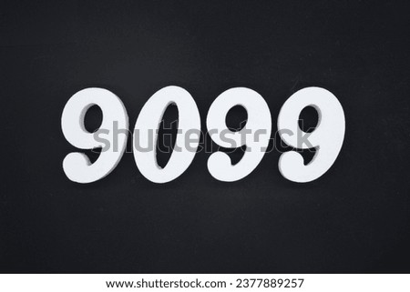 Black for the background. The number 9099 is made of white painted wood.