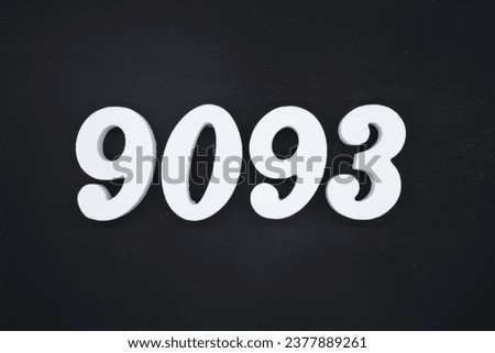 Black for the background. The number 9093 is made of white painted wood.