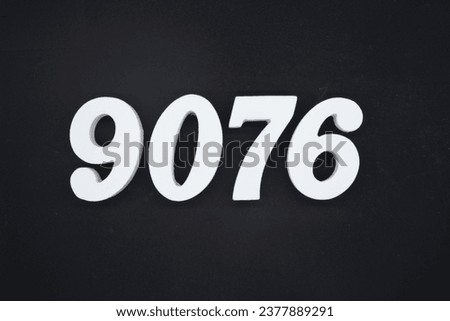 Black for the background. The number 9076 is made of white painted wood.