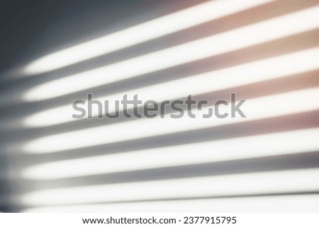 Abstract drop shadow and striped diagonal light background on gray wall from window for backdrop and design