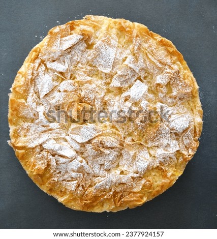 Filo pastry pie, custard Greek pie top view, mediterranean food picture, bougatsa krema traditional pie from Thessaloniki