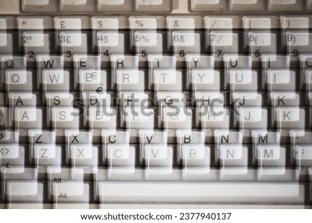 Double focusing vision of a keybord. Example of vision with Astigmatism, a refractive error that causes distorted or blurred or double focusing vision. Royalty-Free Stock Photo #2377940137