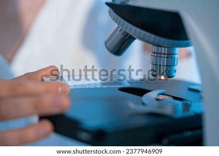 Cell structure investigation: Microscopes allow visualizing microscopic cell structures such as nuclei, mitochondria, and endoplasmic reticulum. Royalty-Free Stock Photo #2377946909