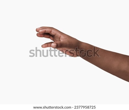 African child hand with gesture of catching against a white background Royalty-Free Stock Photo #2377958725