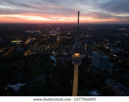 Aerial drone view of the Dortmund, Germany, tv tower Florianturm, at night. City skyline.