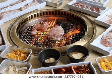 Korean BBQ samgyeopsal grilled thin sliced meat Royalty-Free Stock Photo #2377974031