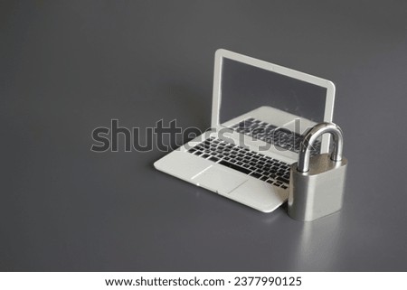 Closeup image of laptop and padlock with copy space. Cyber security concept.