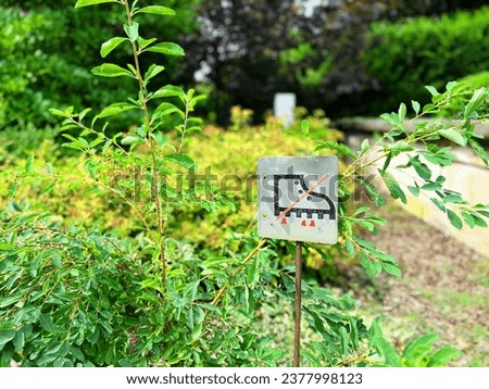 No crossing sign, do not destroy vegetation and flowers, shoe sign, do not enter the lawn, respect for the environment, gardening signs sustainable, ecological, flora, garden care, sustainability, no 