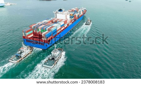 Cargo container ship carrying container and running with tug boat for import goods to cargo yard port to customs. concept logistics transportation and shipping.

