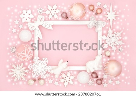 Christmas north pole background of sparkling ornaments and snow with white frame. Festive happy holidays design for greeting card, label, gift tag, Noel, Yule, winter on pink.