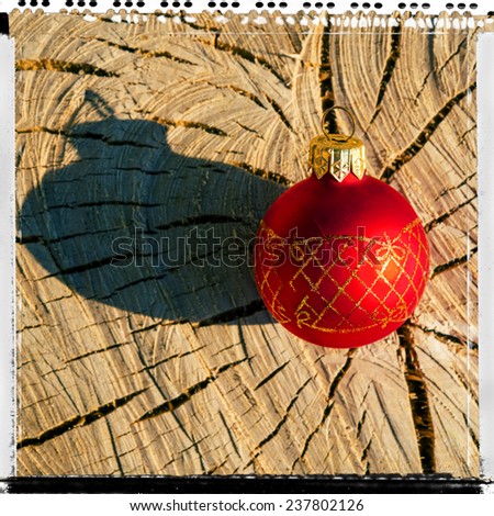 Christmas tree decorations on a background of cracked wood