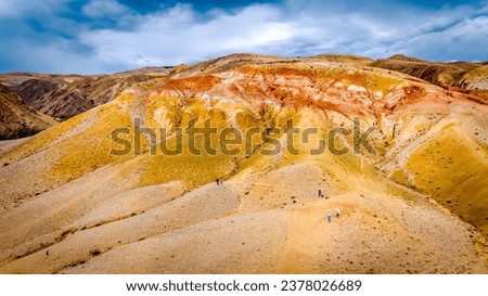 Martian landscapes in the Altai Mountains. Red colorful mountains in Altai, Siberia, Russia. Kyzyl-Chin valley, also called as Mars valley. Natural texture of sandstone.