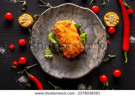 Cordon bleu schnitzel on a gray plate Royalty-Free Stock Photo #2378038581