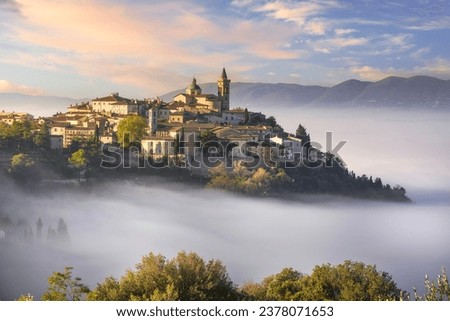 Trevi picturesque village in a foggy morning. Perugia, Umbria, Italy, Europe. Royalty-Free Stock Photo #2378071653