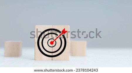 Photo mix of wooden block graphics and target icons, business target concept.