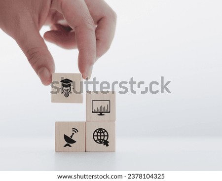 Photo mix of graphics, wooden blocks and online learning icons, online learning concept.