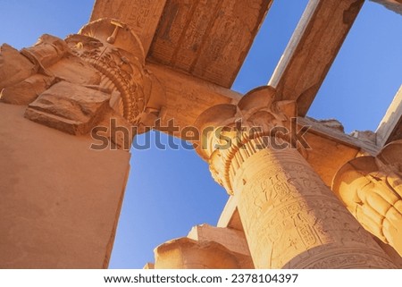 Columns at the Temples of Karnak.  Blue sky in the background. Luxor, Egypt.