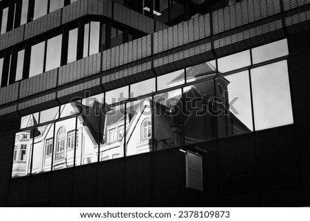 Building Reflection Through Building Window Royalty-Free Stock Photo #2378109873