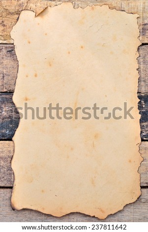 old paper on brown aged wood 