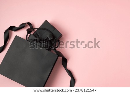 Black shopping bag and box with ribbon. Black friday sale template. Mockup, flatlay, top view