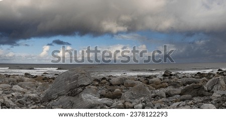 
Panoramic photography on the coast of Alnes facing the Atlantic Ocean. Alnes is a picturesque fishing town on the island of Godoy. Dramatic sky with storm clouds, Norway