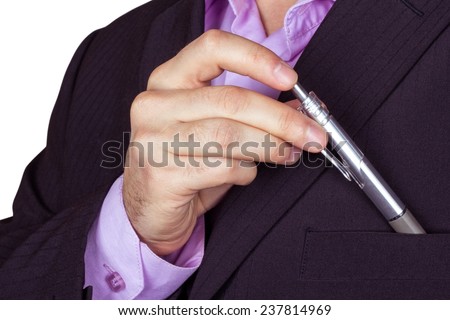 A man in a business suit with a pen in his hand. Pocket of the jacket, ball-pen and men hairy hand on a white background. The concept of a successful businessman.