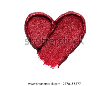 Red lipstick shimmering texture in heart shape, texture stroke isolated on white background. Cosmetic product smear smudge swatch