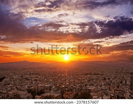 Sunset with dramatic sky over Athens city, Greece