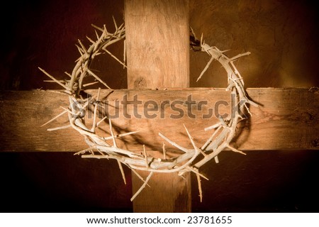 Crown of thorns hanging on a wooden cross at Easter Royalty-Free Stock Photo #23781655