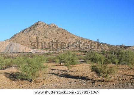 Distant mountains and Arizona State Route 51 and as seen from a family-friendly Phoenix Mountain Preserve also known as Dreamy Draw desert recreation area Royalty-Free Stock Photo #2378171069