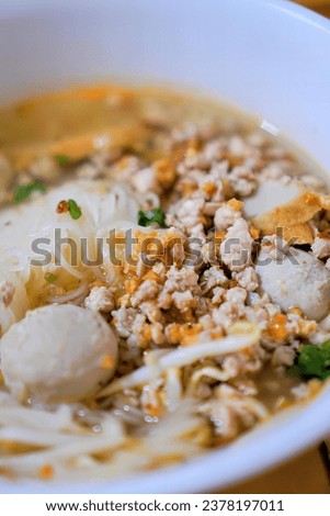 a bowl of noodle soup with noodles.