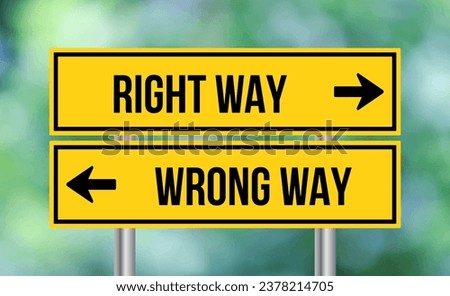 Right way or wrong way road sign on blur background Royalty-Free Stock Photo #2378214705