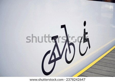 Bicycle sign and wheelchair on the platform in the train station, stock photo