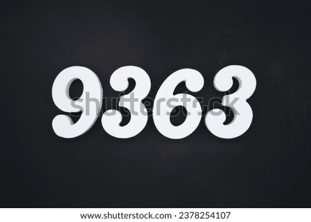 Black for the background. The number 9363 is made of white painted wood.