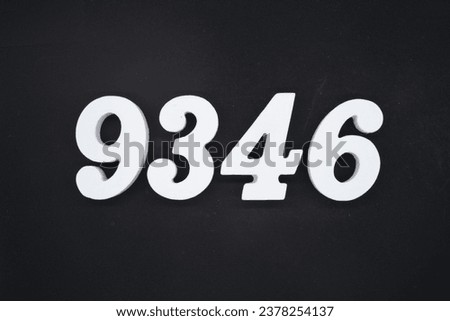 Black for the background. The number 9346 is made of white painted wood.