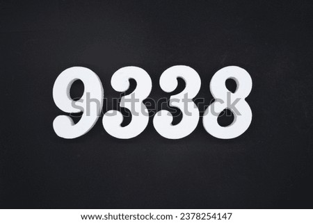 Black for the background. The number 9338 is made of white painted wood.