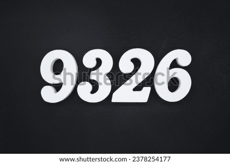 Black for the background. The number 9326 is made of white painted wood.