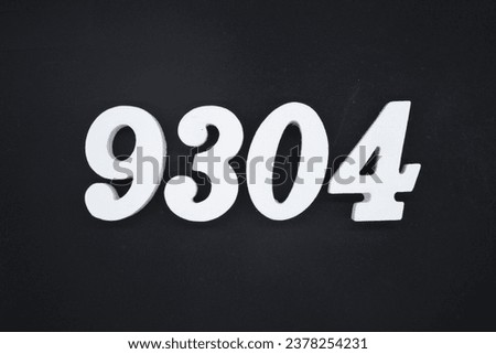 Black for the background. The number 9304 is made of white painted wood.