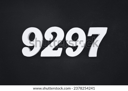 Black for the background. The number 9297 is made of white painted wood.