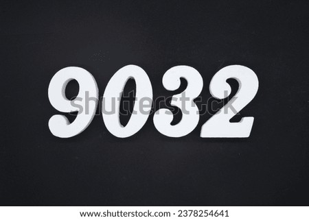 Black for the background. The number 9032 is made of white painted wood.