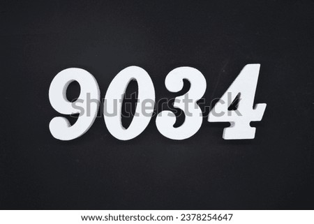 Black for the background. The number 9034 is made of white painted wood.