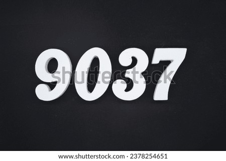 Black for the background. The number 9037 is made of white painted wood.