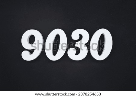 Black for the background. The number 9030 is made of white painted wood.